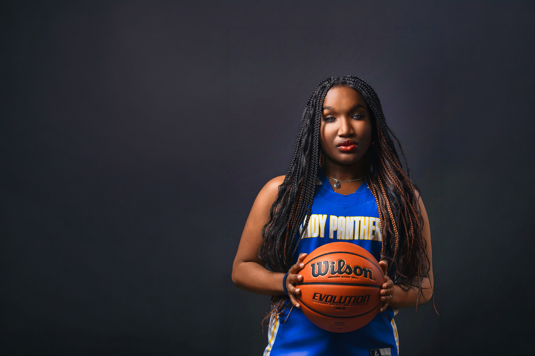 Elite athlete identity portrait — basketball, studio-lit environmental profile