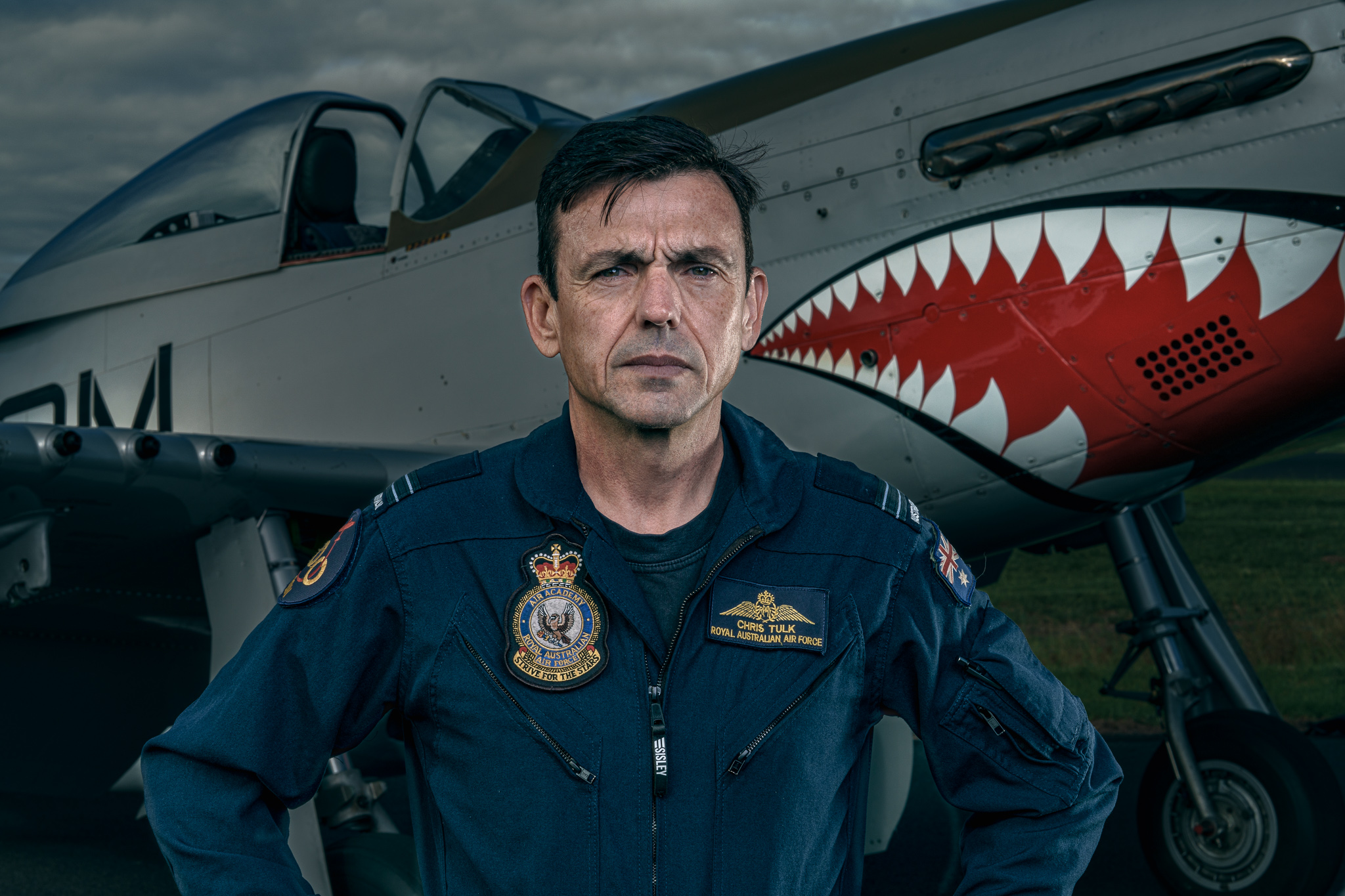 FLTLT Chris Tulk — 100 Squadron RAAF authority portrait with P-51D Mustang AM-G, campaign-grade institutional imagery with rights-cleared deployment